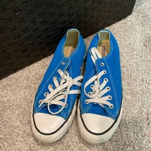 Bright blue converse all stars.